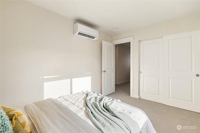 bedroom featuring carpet floors and a wall unit AC