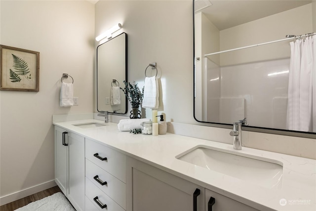 bathroom featuring vanity and wood-type flooring