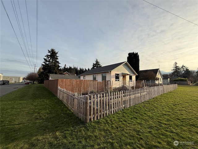 view of front of house with a yard