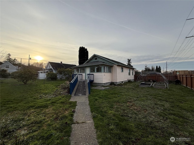 view of front of house with a yard