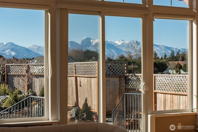 doorway with a mountain view and a wealth of natural light