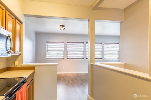 kitchen featuring range with electric cooktop and light hardwood / wood-style flooring