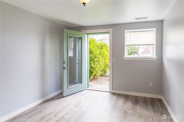 doorway to outside with light hardwood / wood-style floors