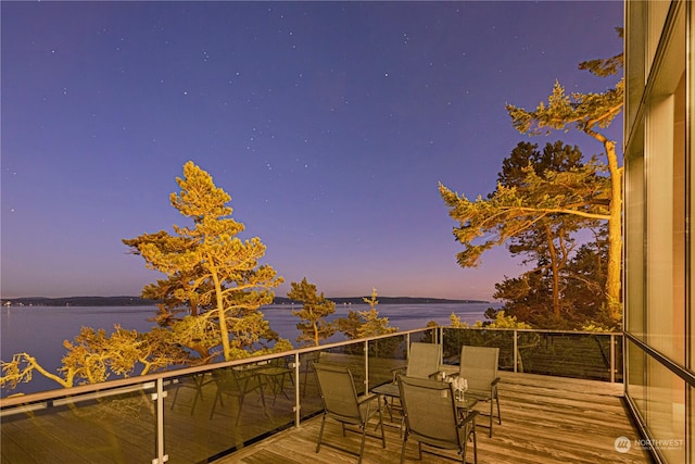 deck at dusk with a water view