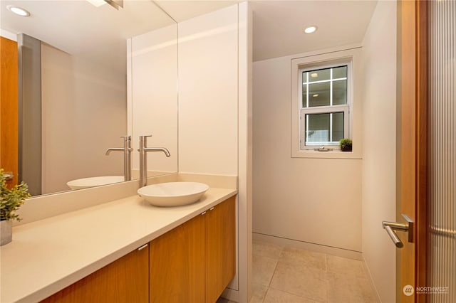 bathroom featuring tile patterned floors and vanity