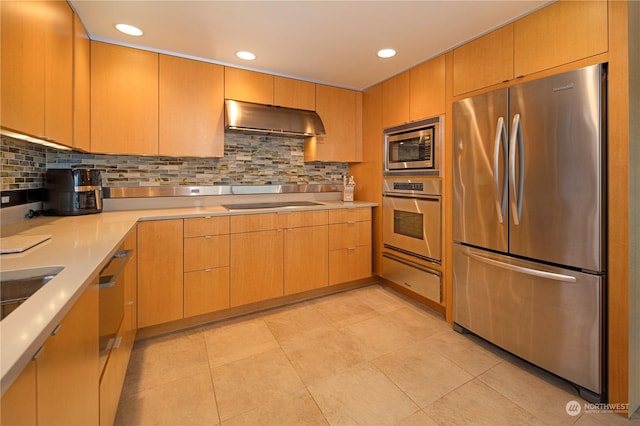 kitchen featuring appliances with stainless steel finishes, light tile patterned floors, and backsplash