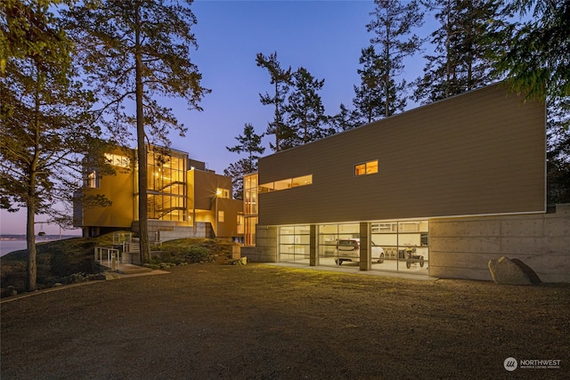 view of outdoor building at dusk