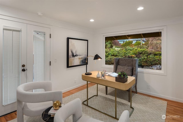 office space featuring crown molding, hardwood / wood-style flooring, and french doors