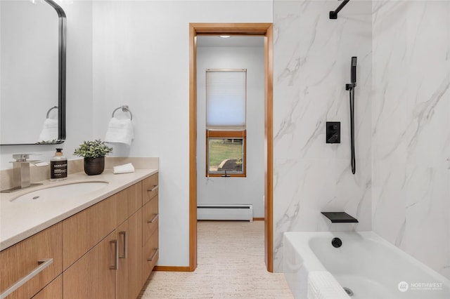 bathroom with tiled shower / bath combo, vanity, and a baseboard heating unit