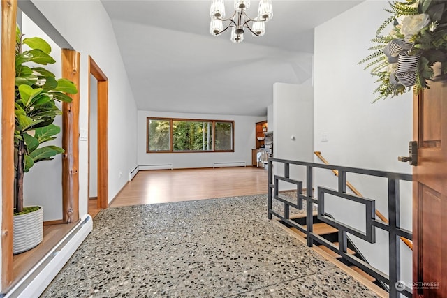 interior space featuring a baseboard radiator, vaulted ceiling, a chandelier, and light hardwood / wood-style floors