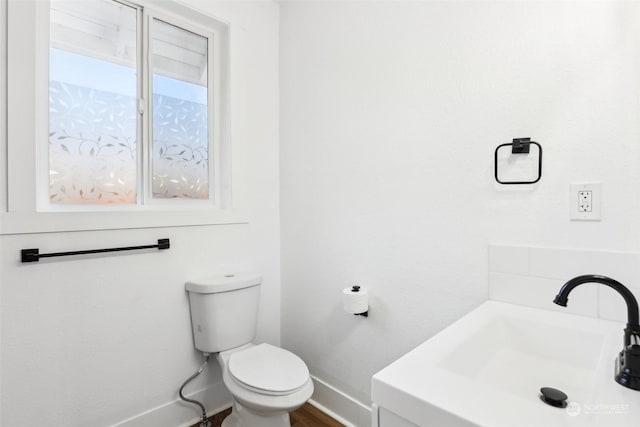 bathroom featuring sink and toilet