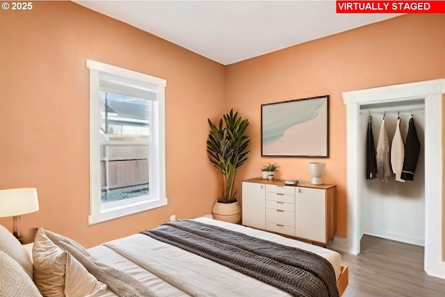 bedroom with hardwood / wood-style floors