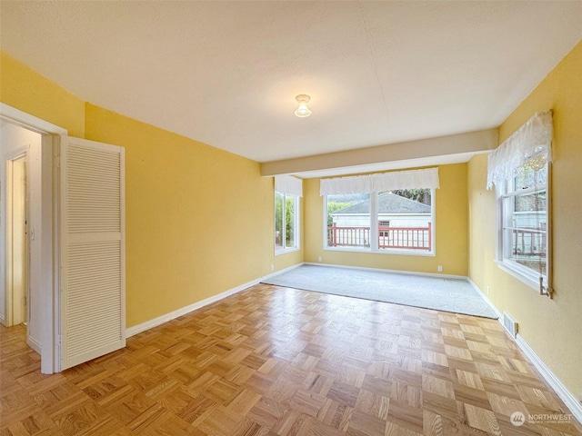 spare room with light parquet flooring