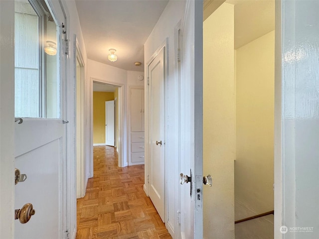 corridor featuring light parquet flooring