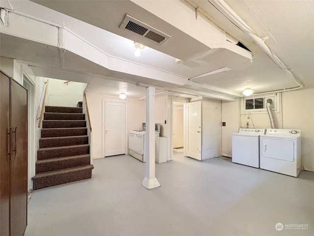 basement with washing machine and dryer