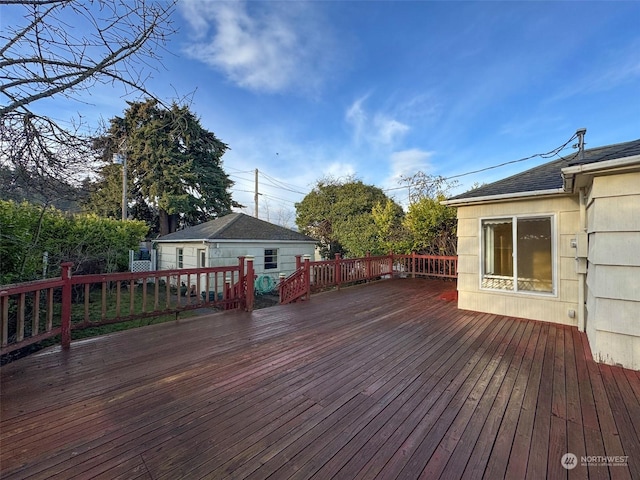 wooden deck with an outdoor structure