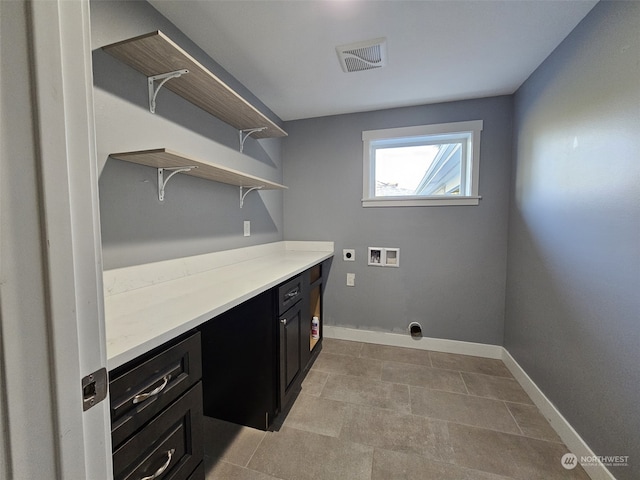 laundry area with hookup for a washing machine and hookup for an electric dryer