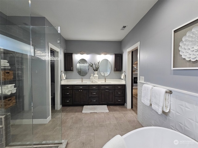 bathroom featuring vanity and plus walk in shower