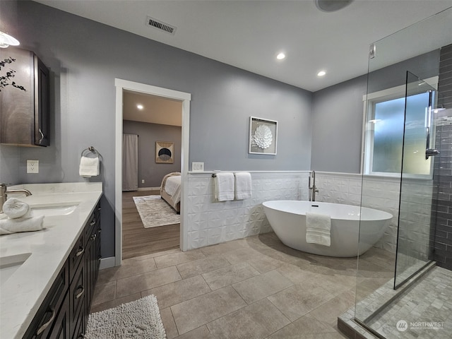 bathroom featuring vanity, tile patterned floors, and independent shower and bath