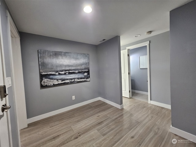 empty room with light wood-type flooring