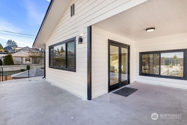 view of side of property with a patio area