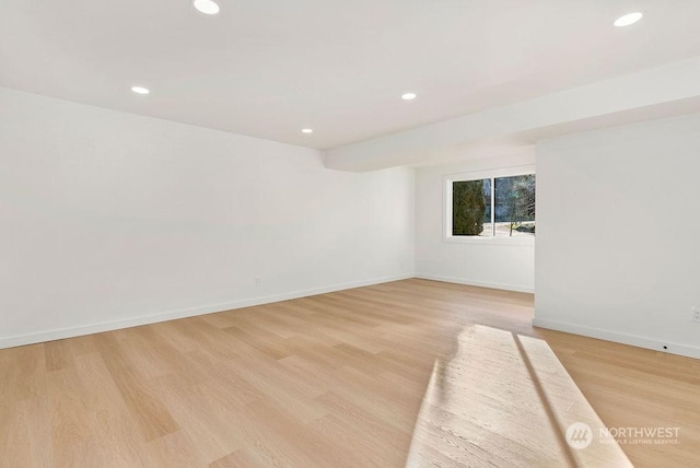 spare room with light wood-type flooring