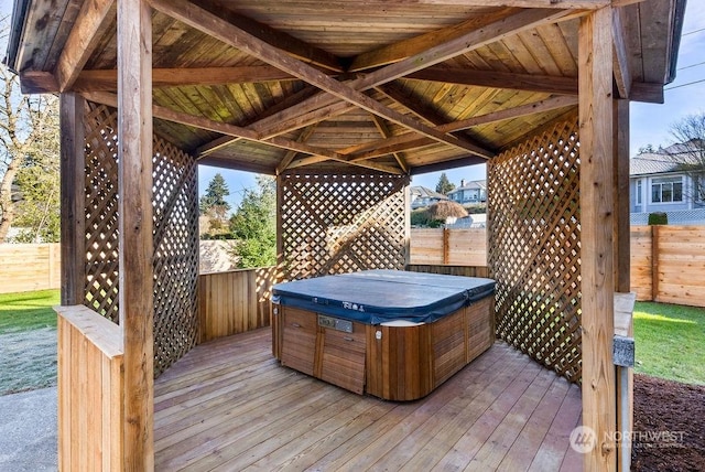 wooden terrace with a hot tub