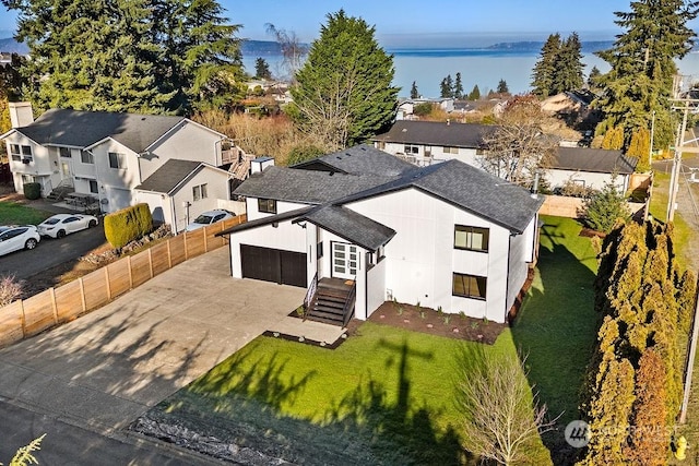 birds eye view of property featuring a water view