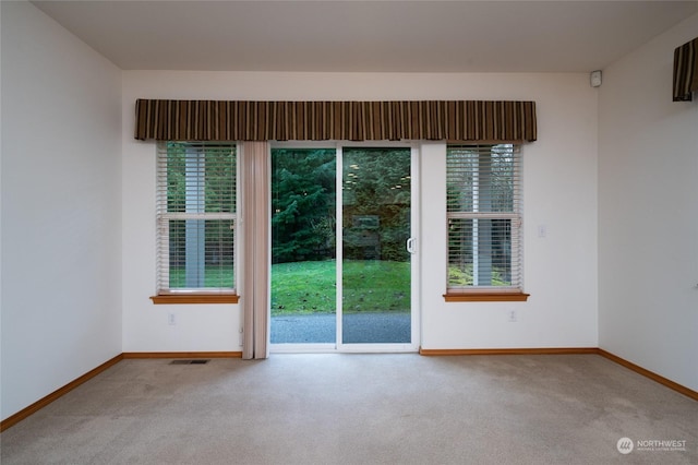 empty room with light colored carpet