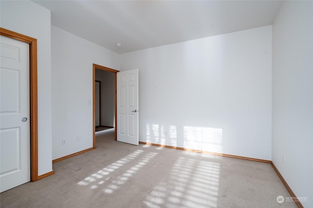 spare room with light carpet