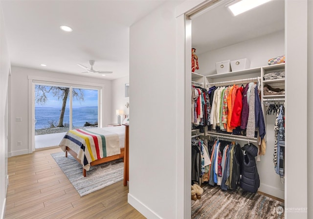 bedroom with access to outside, a closet, and light wood-type flooring