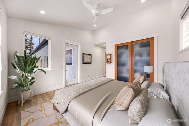 bedroom featuring access to exterior, ceiling fan, and light wood-type flooring