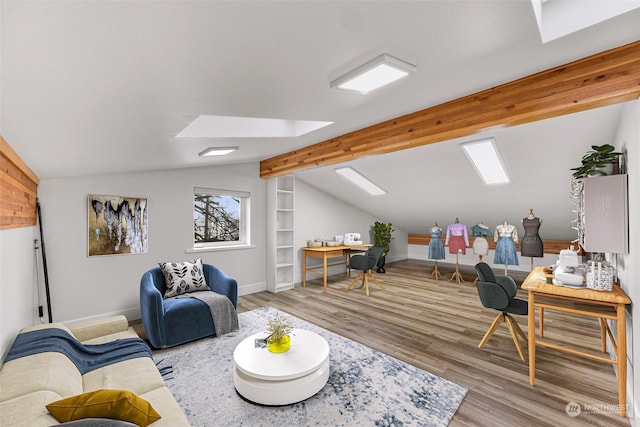 living room featuring vaulted ceiling with beams and hardwood / wood-style flooring