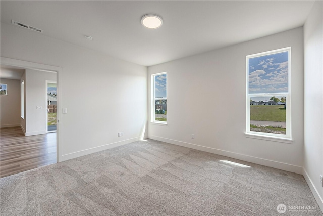 402 Pagget Ave, Winlock, WA 98596 - carpeted empty room with baseboards and plenty of natural light