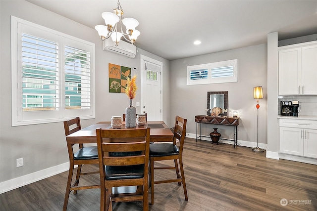 dining area with dark hardwood / wood-style floors, an AC wall unit, and a chandelier