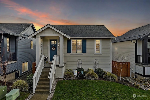 view of front of property with a lawn