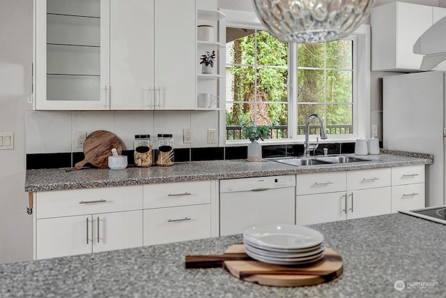 kitchen with dishwasher and white cabinets