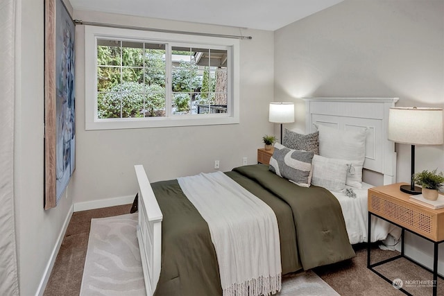 bedroom with dark carpet