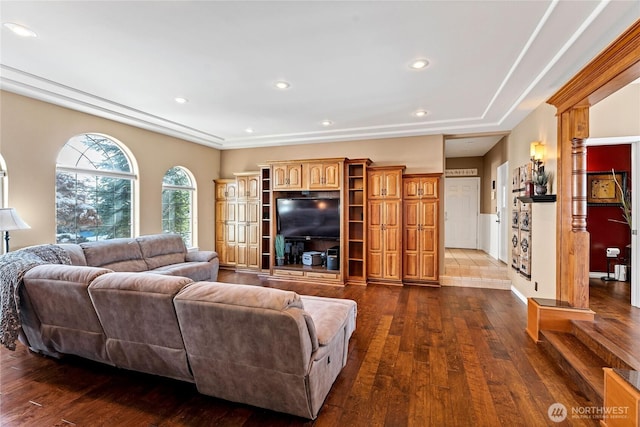 living room featuring ornate columns and dark hardwood / wood-style flooring