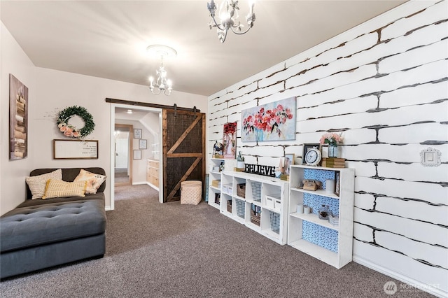 sitting room with a barn door, carpet flooring, and a chandelier