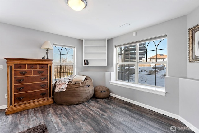 sitting room with dark hardwood / wood-style floors