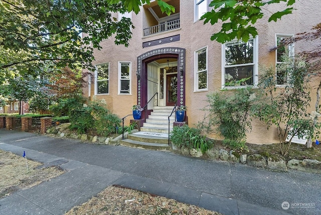 doorway to property featuring a balcony