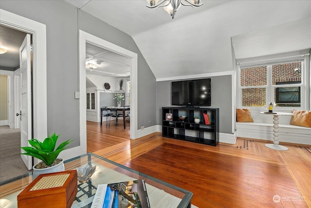 living room with wood-type flooring and lofted ceiling