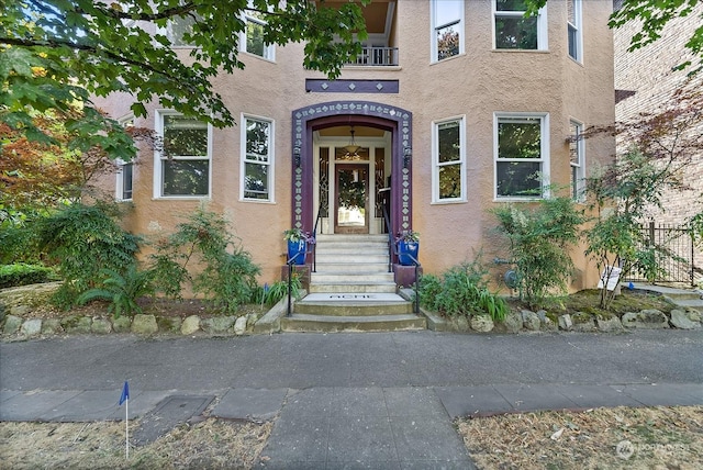 doorway to property featuring a balcony