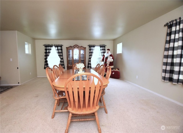 view of carpeted dining space