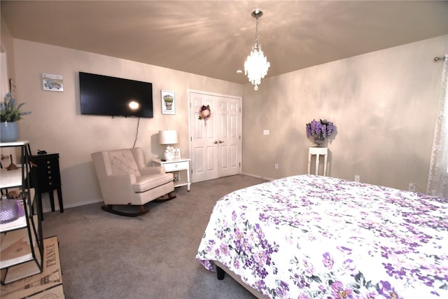 carpeted bedroom with a chandelier and a closet