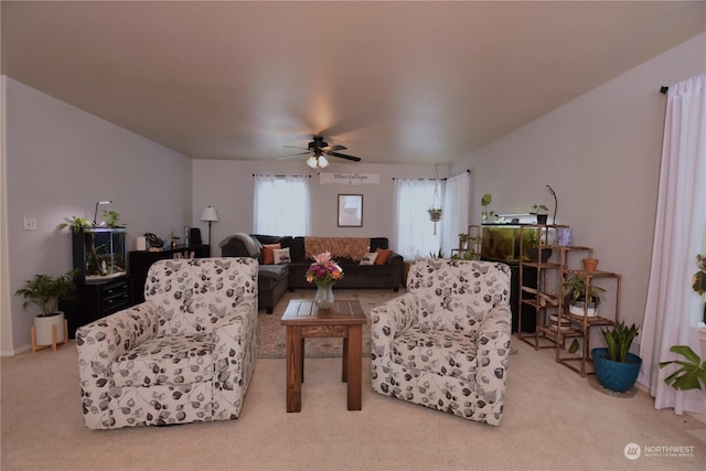 living room featuring ceiling fan and light carpet