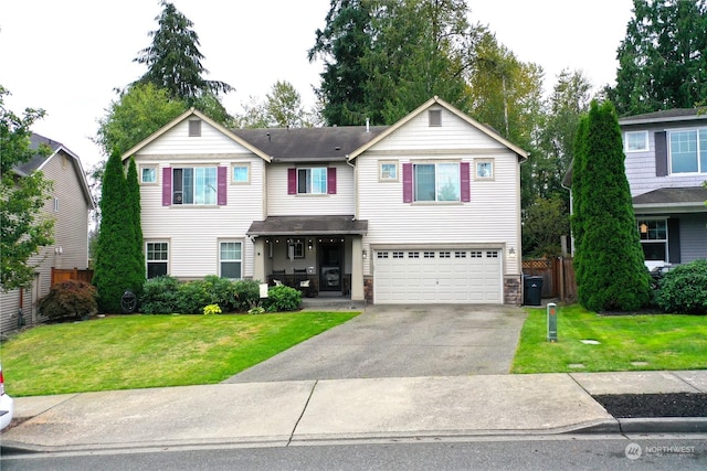 view of front facade with a garage and a front lawn