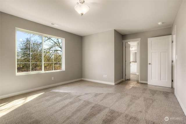 unfurnished bedroom with light carpet