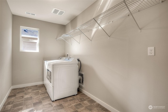 laundry room with washer and dryer